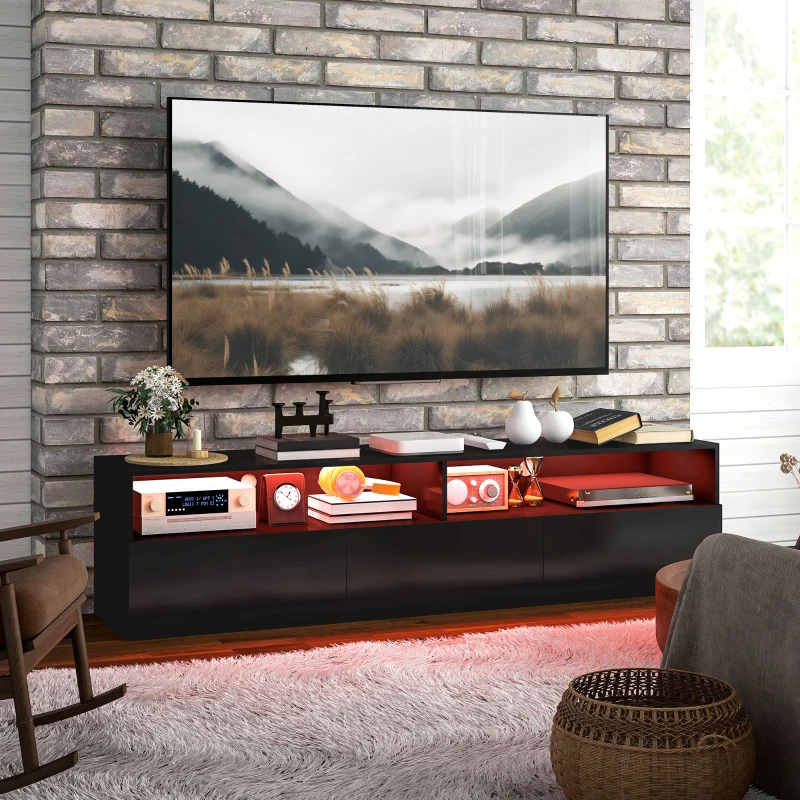 Sleek black LED TV stand with drawers under wall-mounted TV.