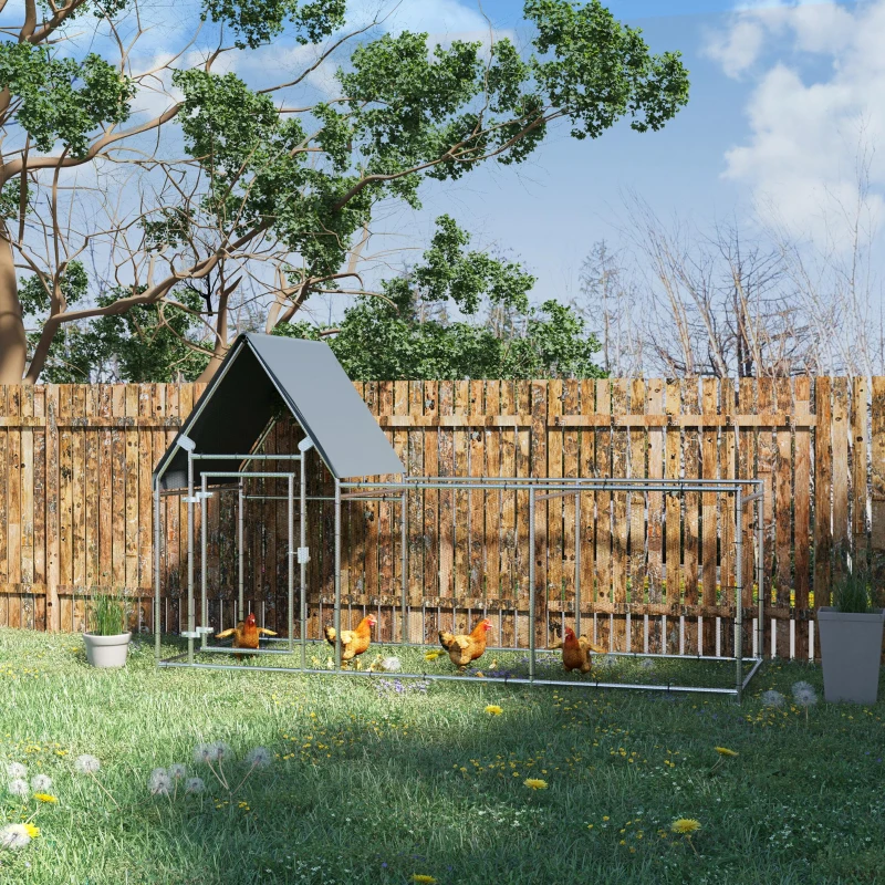 Outdoor walk-in chicken run with curved roof and water-resistant cover surrounded by flowers.