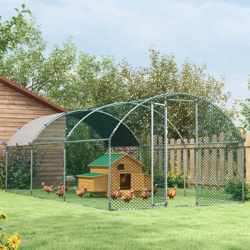 Compact metal chicken coop with mesh fencing and protective roof cover for backyard use.