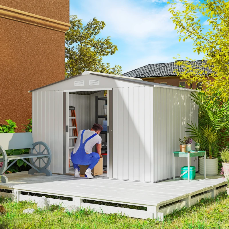 Dark grey steel outdoor shed with wide doors open, bicycle and gardening tools inside.