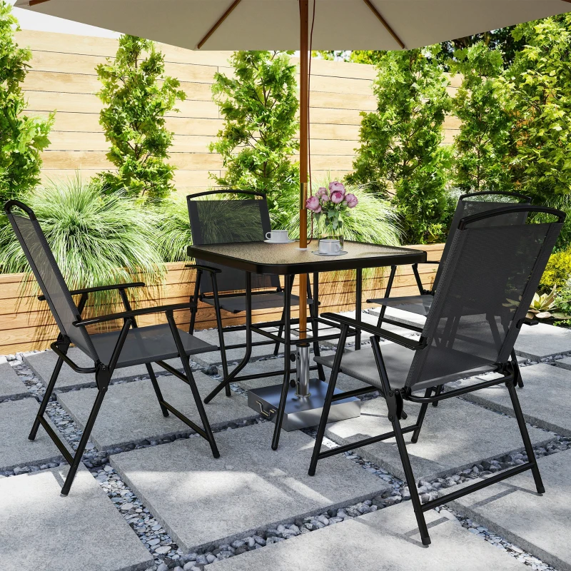 Compact black patio dining set with umbrella in sunny modern backyard garden.