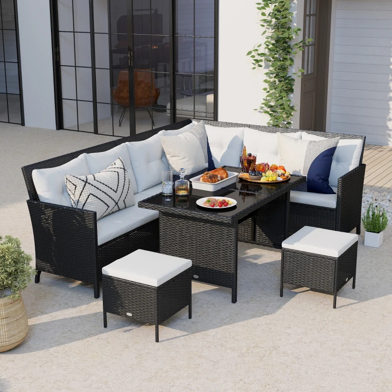 Beige rattan sofa dining set with ottomans and friends chatting outdoors.