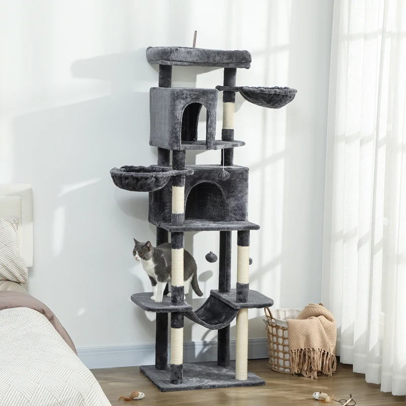 Cat exploring dark-grey tower with condos and hammock.