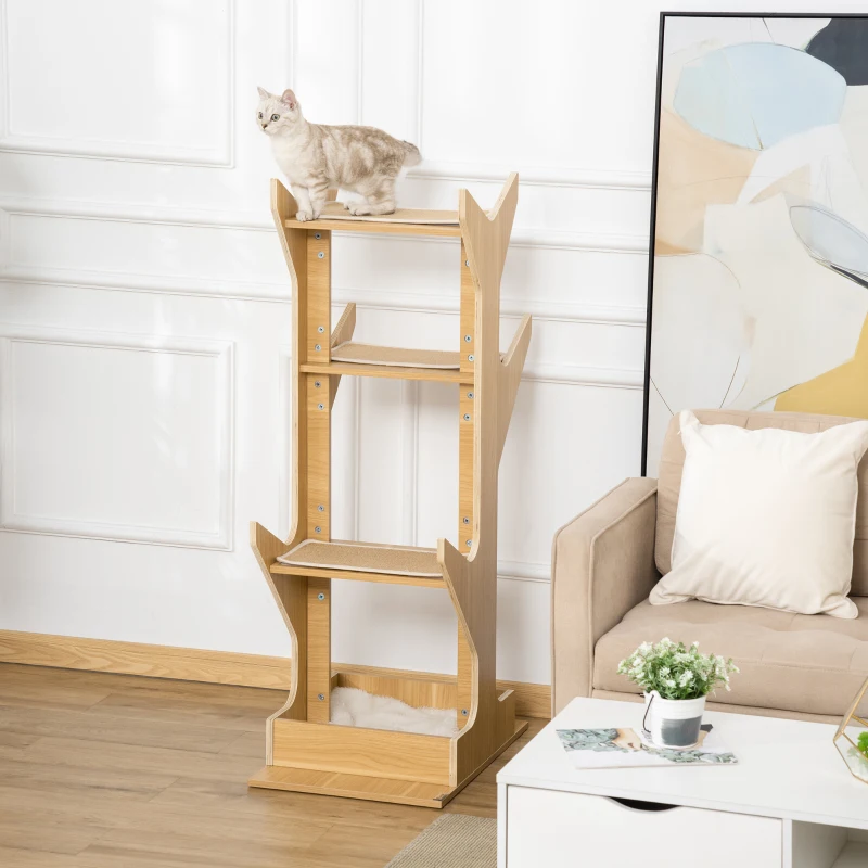 Modern wooden four-level cat tower beside a beige sofa.