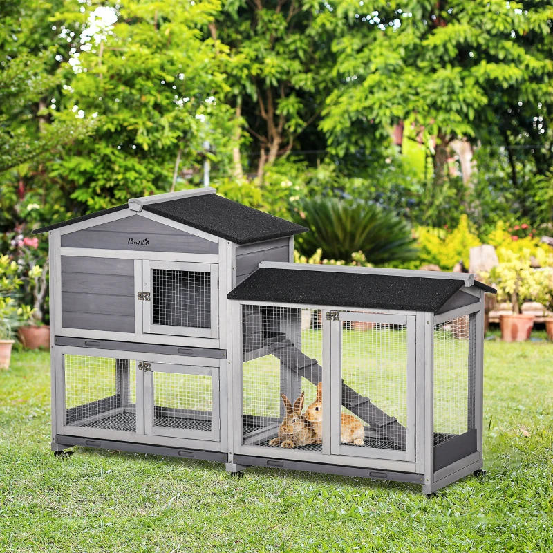 Spacious outdoor grey wooden rabbit hutch with ramp, wheels, and secure wire fencing.