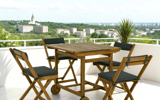 Outsunny wooden 5-piece patio dining set with wheeled table and black cushioned chairs.