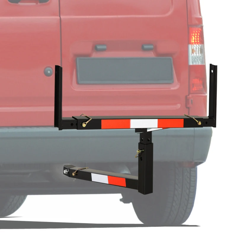 Black metal truck bed extender with red reflective stripes mounted on vehicle rear.