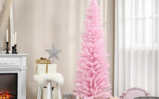 Soft pink Christmas tree with glowing lights and gold ornaments in a cosy living room.