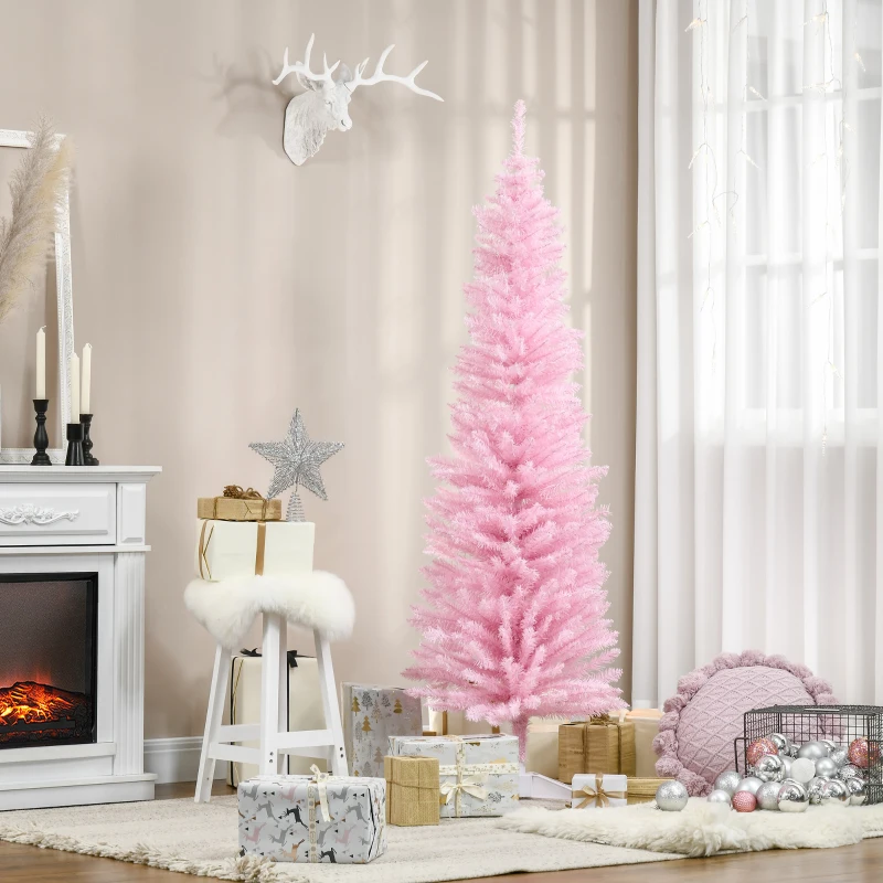 Soft pink Christmas tree with glowing lights and gold ornaments in a cosy living room.