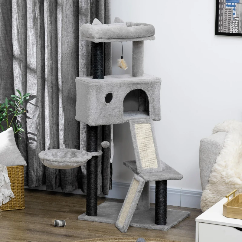 Grey multi-level cat tree with hammock, condo, ramp, and top perch in a modern living room.