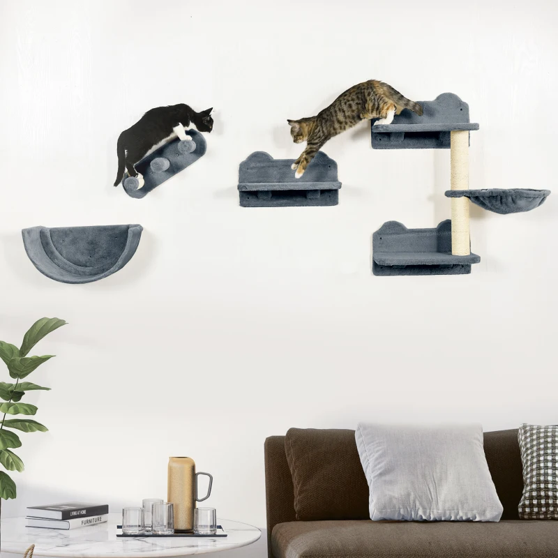 Grey wall-mounted cat shelves and hammock with two cats climbing and playing.