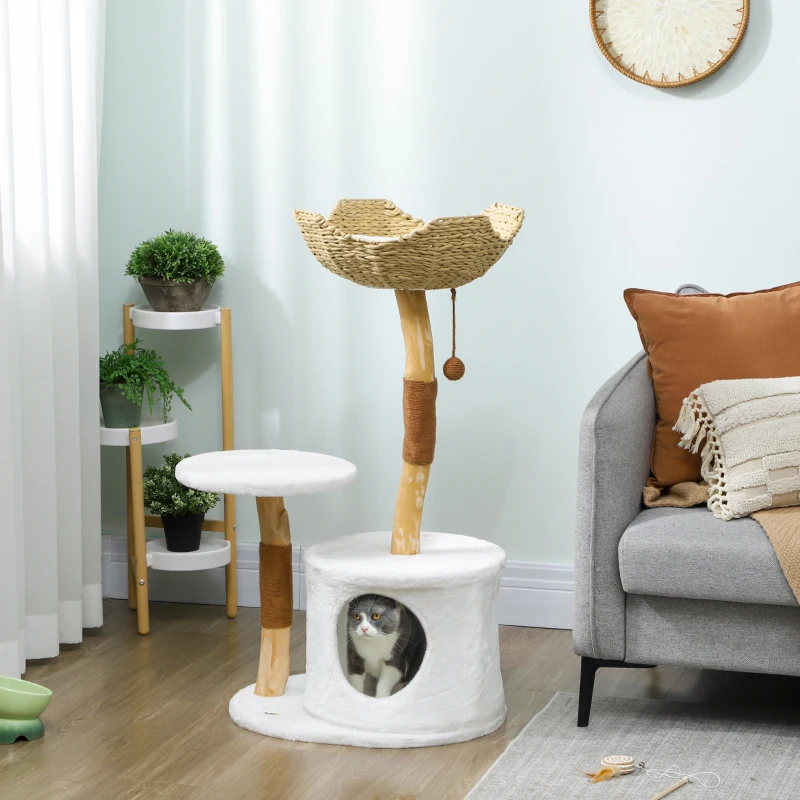 Natural wood cat tree with woven top basket, round perch, white base condo, and a cat inside the cubby.