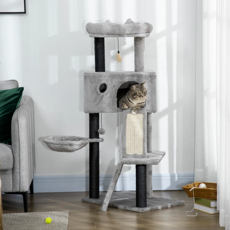Grey cat tree with condo, hammock, sisal ramp, and a cat relaxing inside the upper cubby.