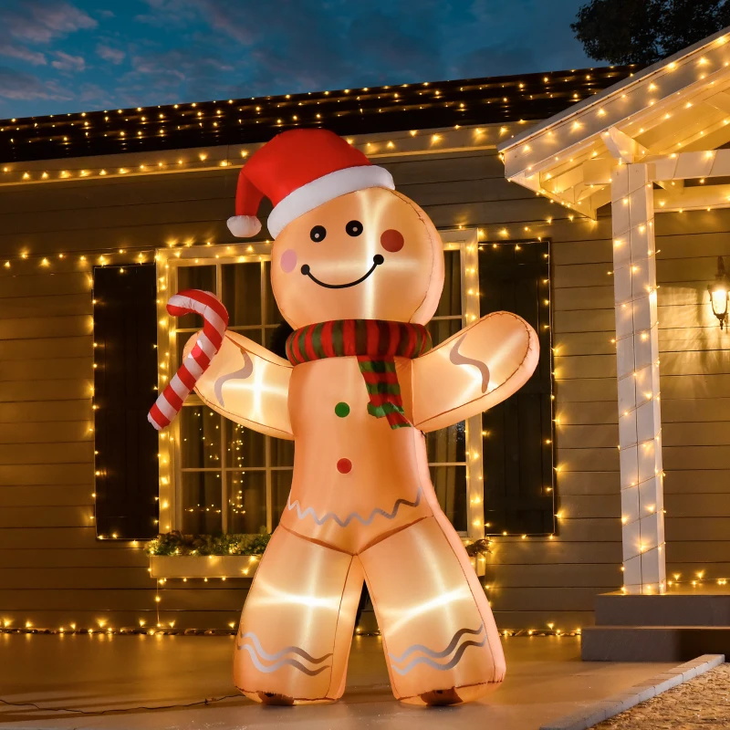 Glowing gingerbread man inflatable with candy cane on porch surrounded by warm Christmas lights.