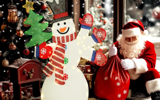 snowman near Santa and Christmas tree.