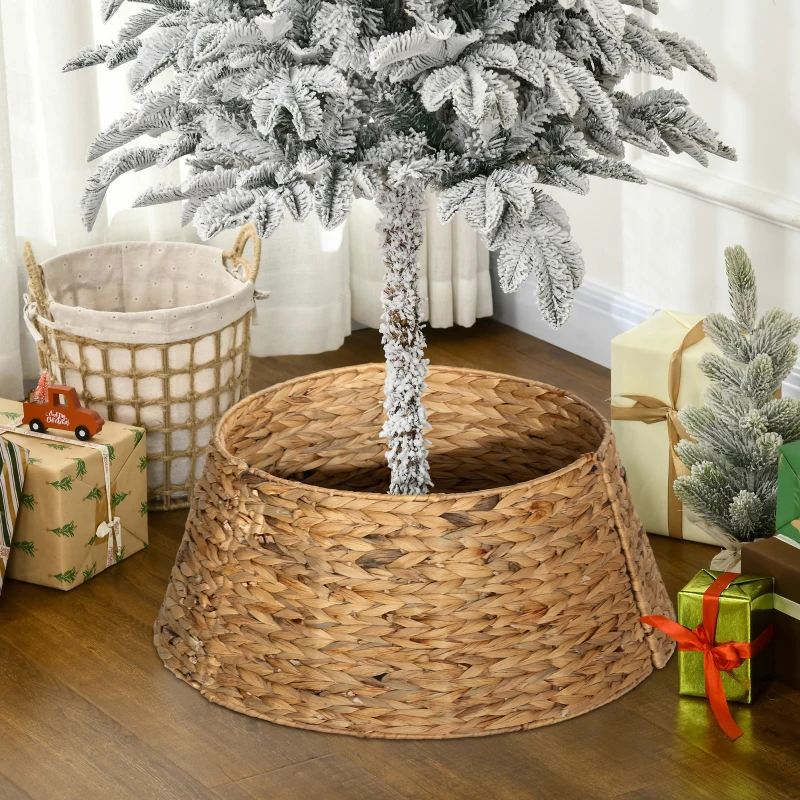 Natural hand-woven water hyacinth Christmas tree collar under a snowy artificial tree with gifts.