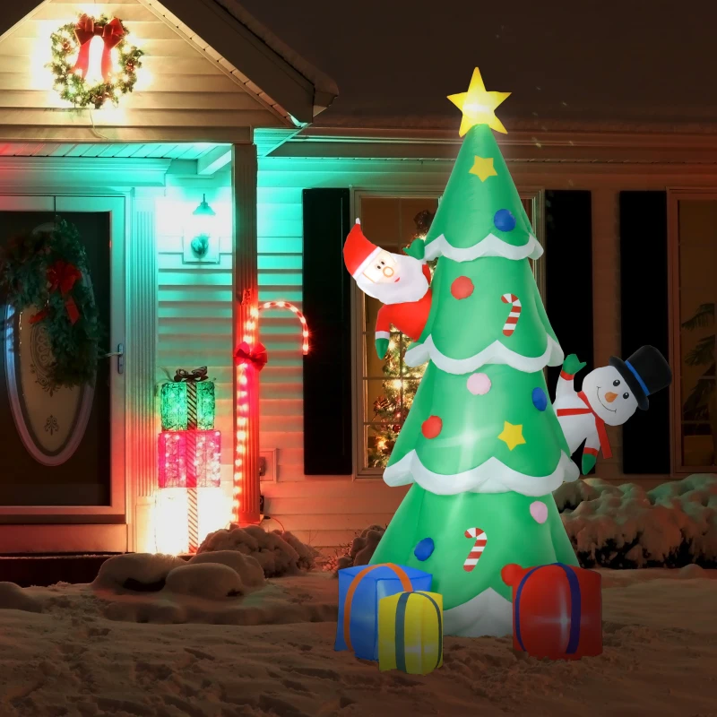 Inflatable tree with Santa and snowman beside glowing gift boxes.