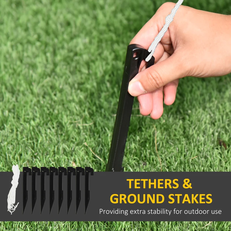 Hand pushing ground stake into grass for outdoor setup