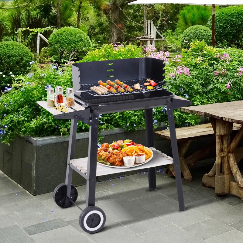 Outdoor garden scene showing Outsunny trolley charcoal grill with trays and food.