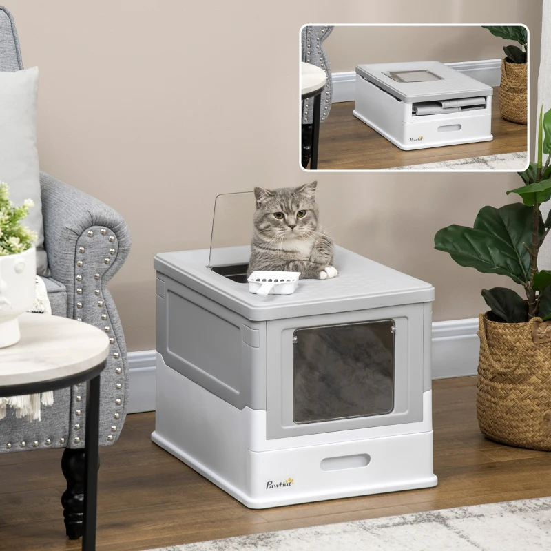 Grey tabby cat sitting inside square top-entry litter box.