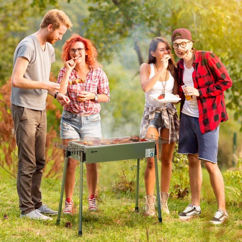 Group of friends barbecuing on green Outsunny portable charcoal grill outdoors.