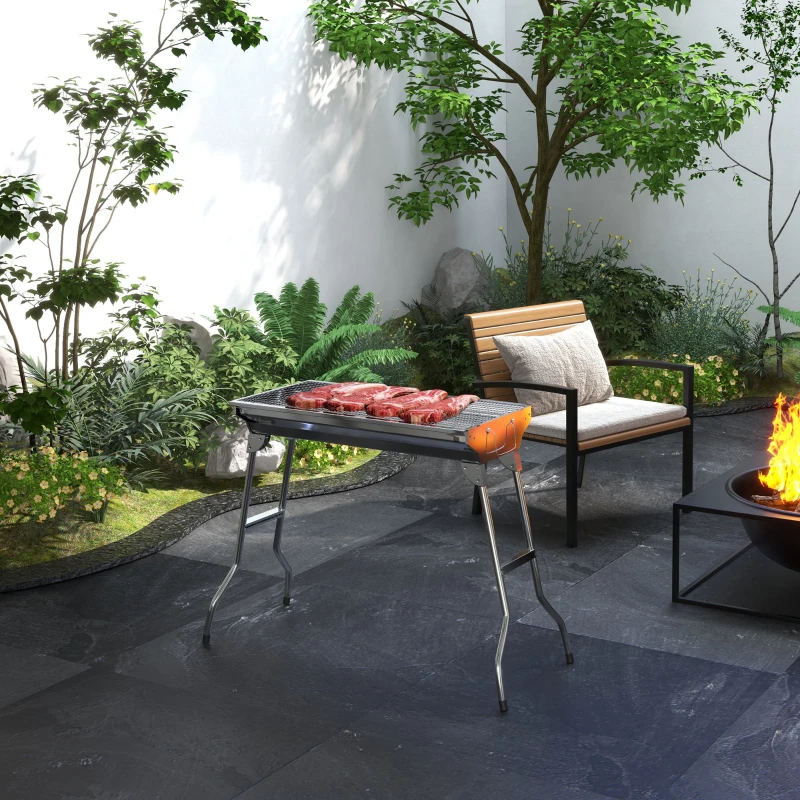 Stainless steel portable Outsunny charcoal grill set up for camping barbecue.