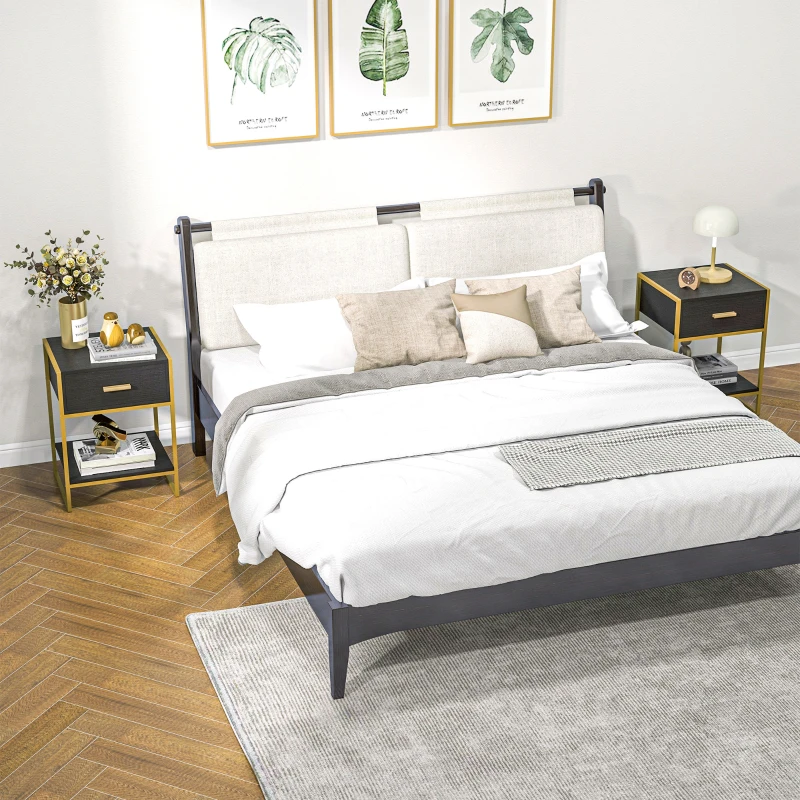 Stylish black and gold nightstands with drawers beside large bed.