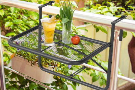 Balcony hanging table holding drinks and flowers.