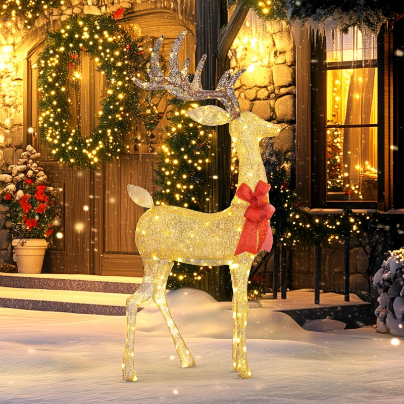 Glowing outdoor Christmas deer with golden lights and red bow in snowy festive garden