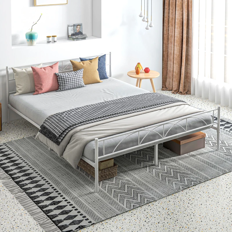 Modern white metal bed frame with layered bedding and throw pillows.
