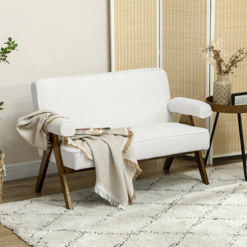 Cream bouclé 2-seater loveseat with wooden legs placed in a cozy minimalist living room