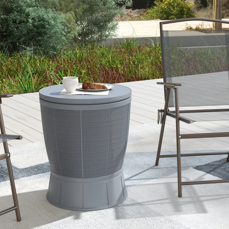 Outdoor patio cooler side table in grey used as a small table beside chairs.