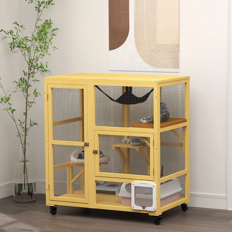 Yellow indoor cat house with shelves and hammock on wheels placed in a bright room.