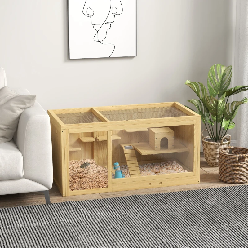 Wooden small-animal habitat with bedding, ramps and hideouts placed beside a sofa in a modern room.