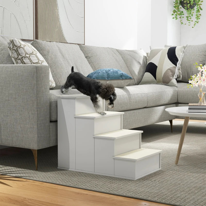   Small dog stepping down white non-slip pet stairs positioned beside a living room sofa.