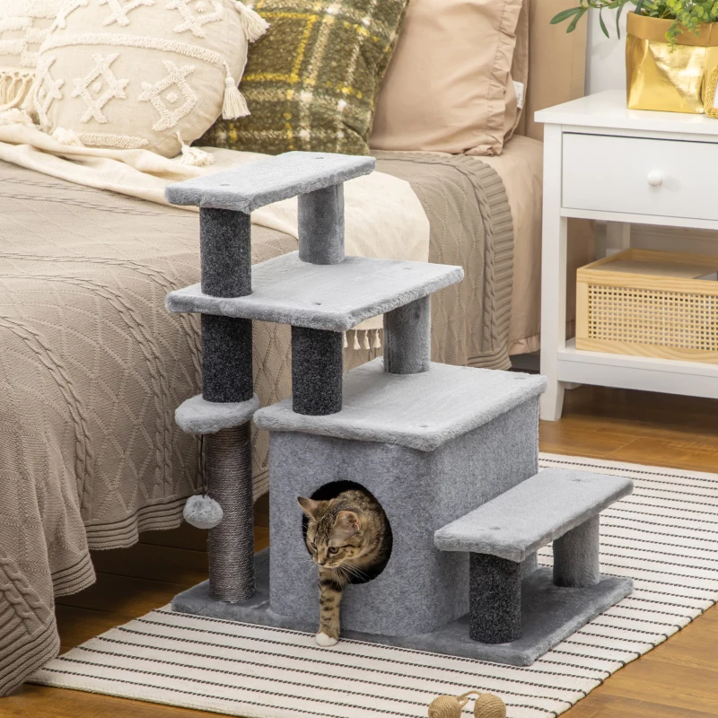   Cat climbing multi-level soft cat stairs with built-in condo and scratching post beside bed.