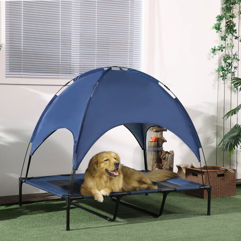 Golden Retriever lying on an elevated dog bed with a canopy for shade and cooling.