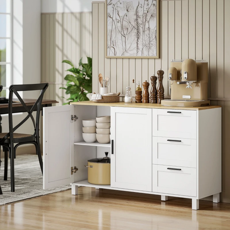 White buffet cabinet with wooden countertop and open door displaying neatly stacked kitchenware