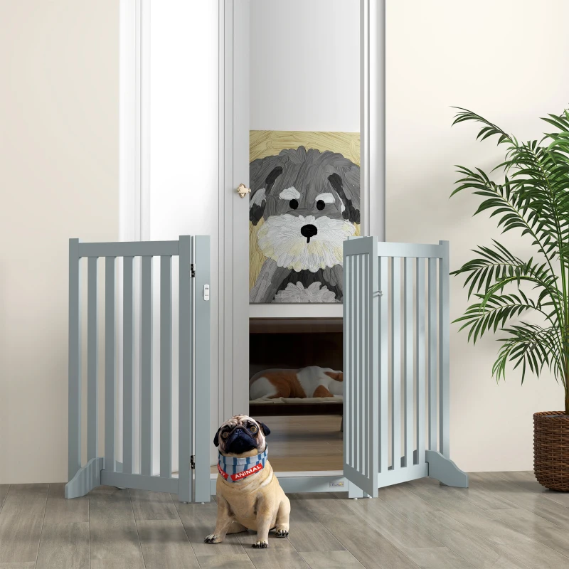 Grey freestanding foldable dog gate with pug in bright room and plant décor.