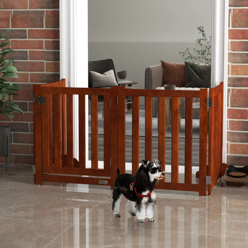 Brown wooden four-panel dog gate with small dog in brick-wall living room entryway.