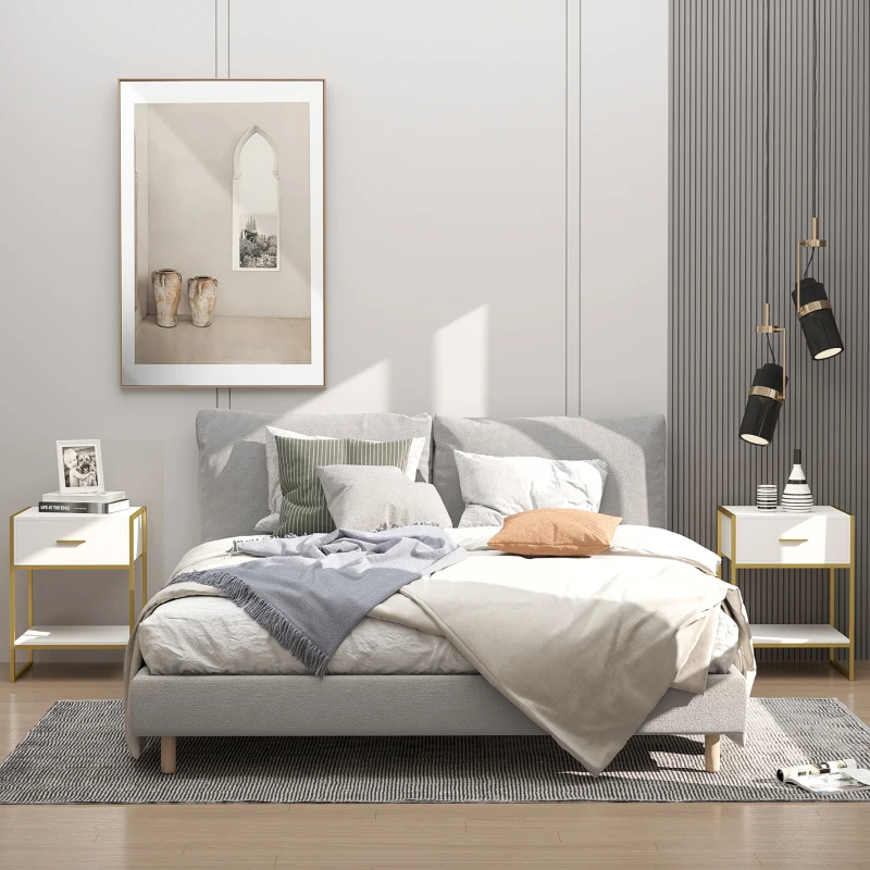 Minimalist bedroom with soft grey bedding and white nightstands on both sides.