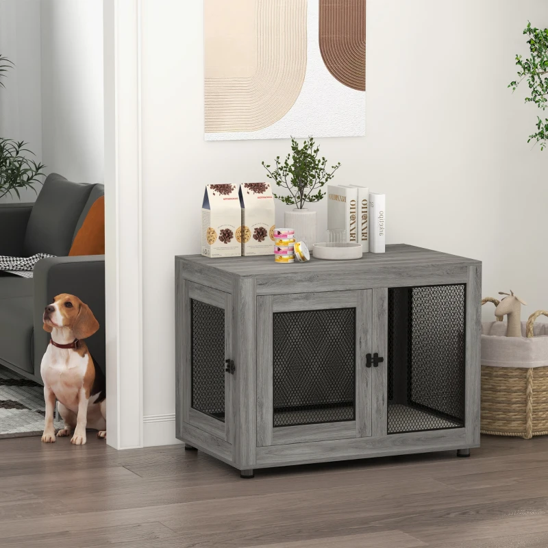 Gray wood dog crate with mesh sides beside dog and décor.