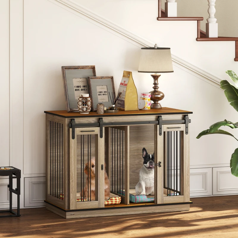 Double dog crate table with two small dogs under staircase.