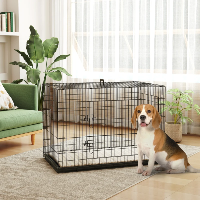 Indoor foldable black wire dog crate with beagle sitting nearby.
