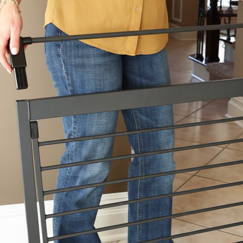 Person attaching metal extensions to a pressure-mounted pet gate frame before installation.