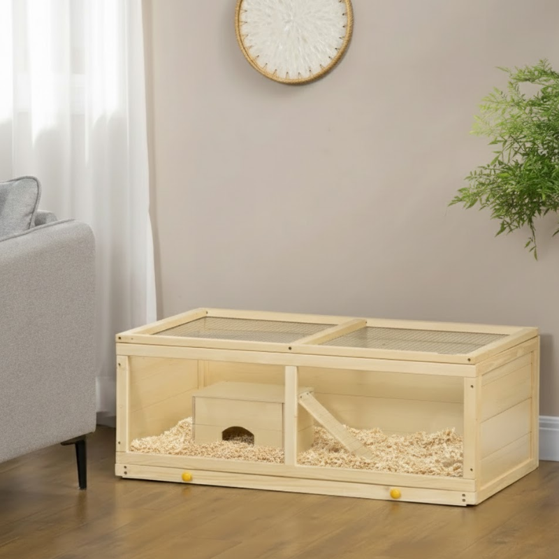 Hands placing hideout, wheel, and dishes back into hamster cage