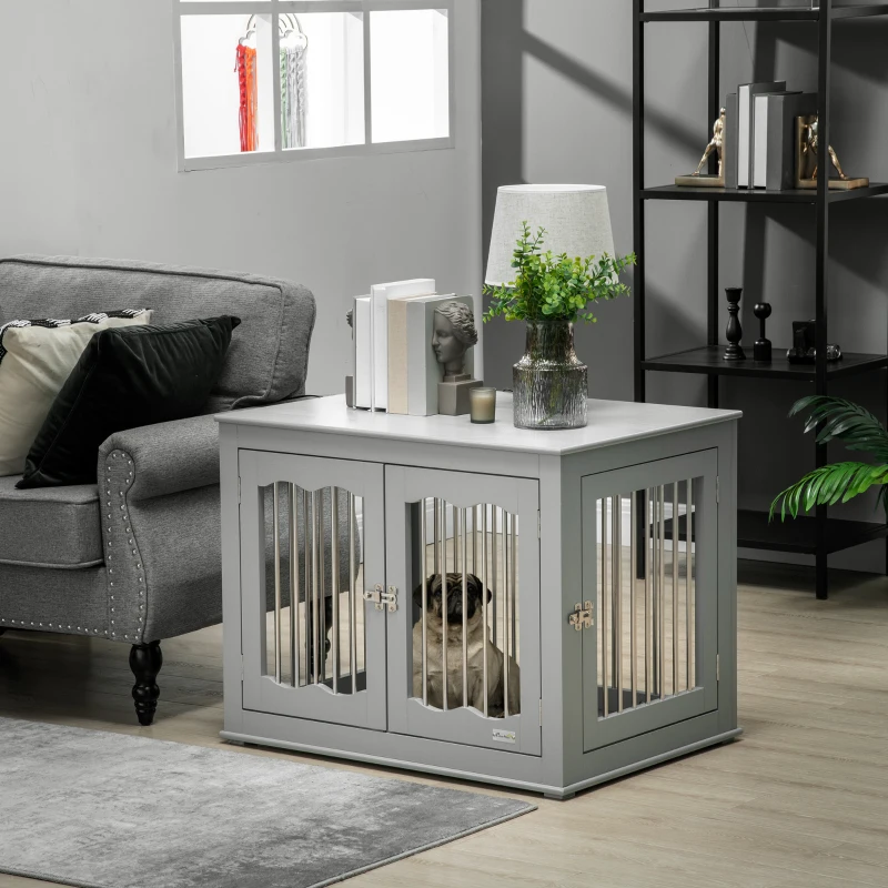 Furniture-style dog crate used as a side table beside a sofa.