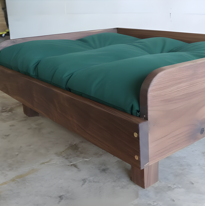Adding a green cushion to a wooden dog bed frame for comfort