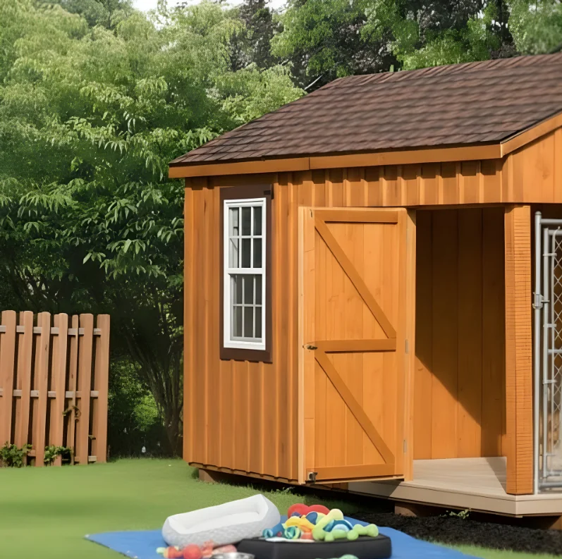 Empty kennel entrance with dog bed, toys, and accessories placed outside on a blue mat.