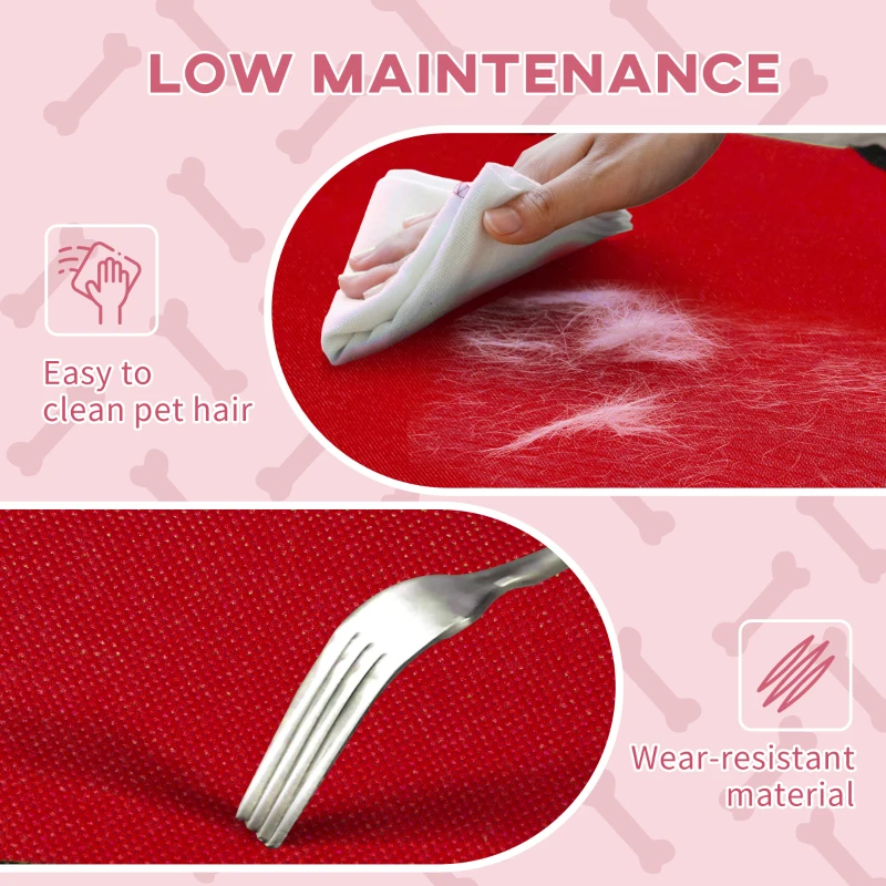 Hand wiping pet hair from red fabric with wear-resistant texture.